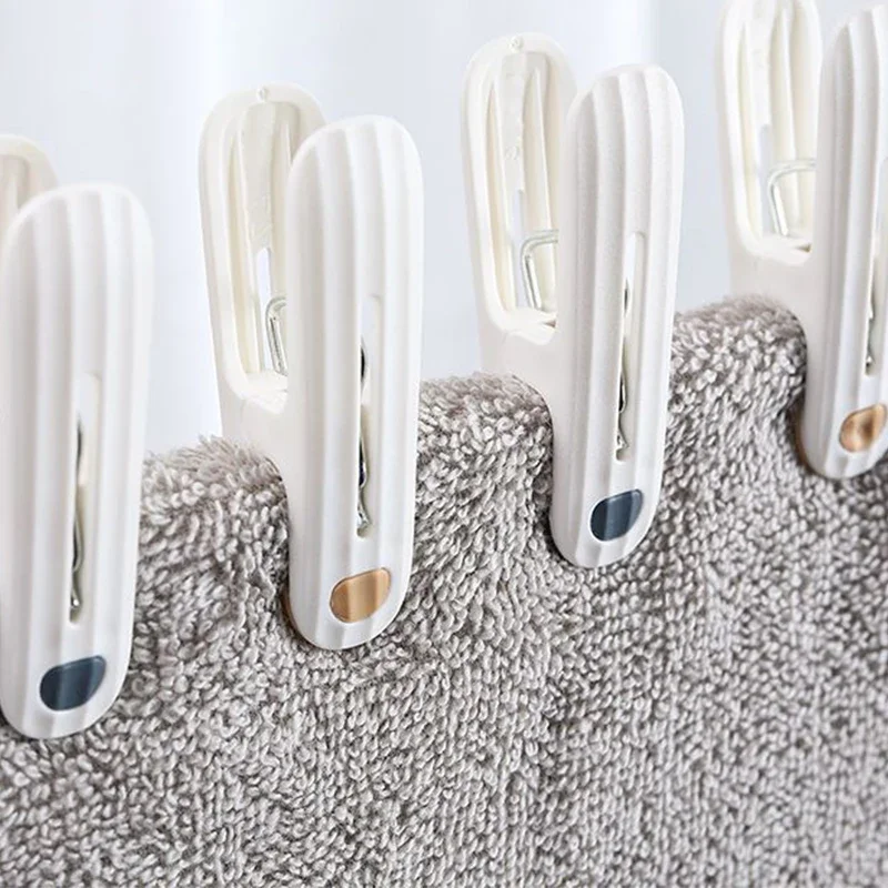 مشبك بلاستيك 12 غير وسم للتجفيف ، ملابس ثابتة مقاومة للرياح ، مشبك جوارب ، بياضات سرير ، مطاط ناعم ، مانع للإنزلاق ، أبيض ناعم