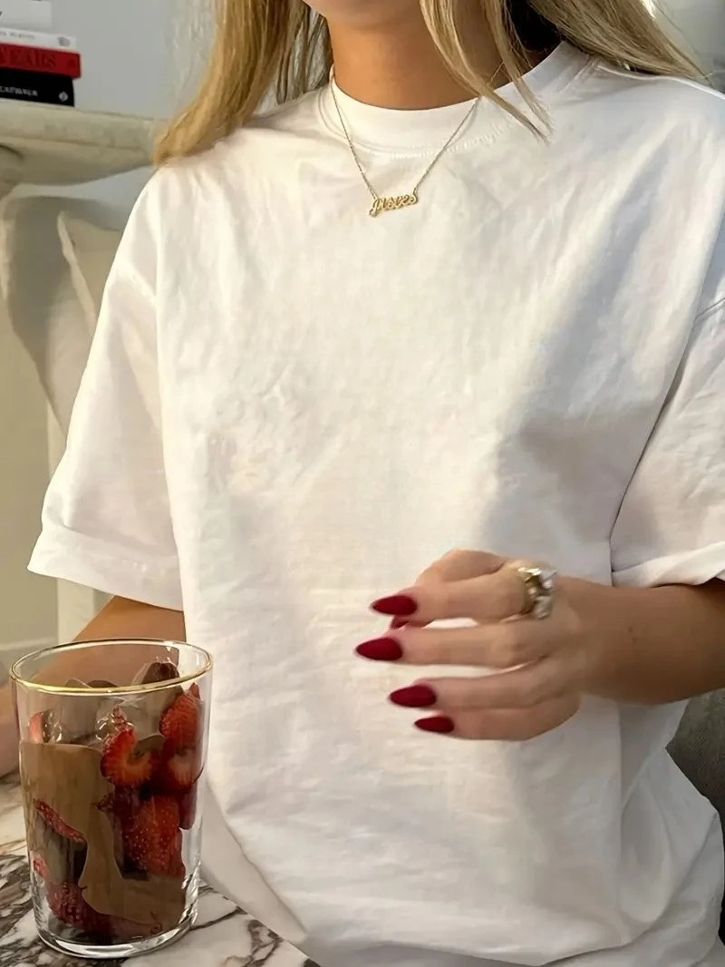 Camiseta de gran tamaño blanca y negra para mujer, camiseta Unisex de algodón informal para parejas y hombres, camiseta de Color sólido, camiseta transpirable, ropa ventilada