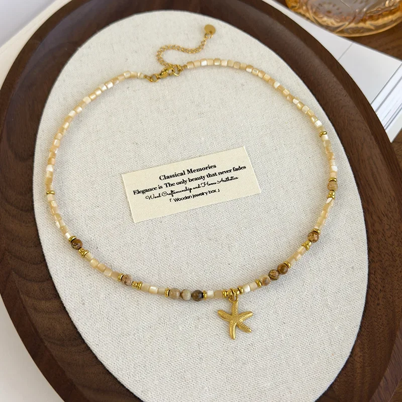 

Chinese Style Natural Stone Shell Tigereye Beads Strand Star Beaded Pendant Necklaces for Women Gold Plated Chain Chokers