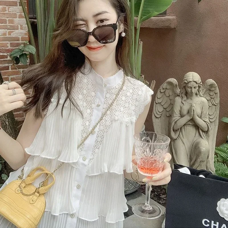 Camicia in chiffon senza maniche bianca scavata per le donne Estate nuova top trendy chic da strada con foglie di loto a pieghe larghe e impiombate