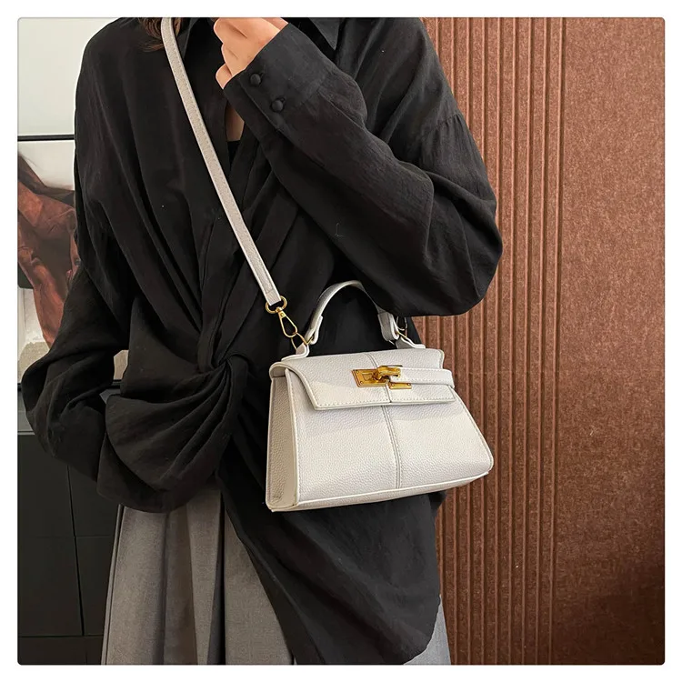 

‌New 2025 Fashion Bag Collection - Minimalist Trapezoid Shoulder Bag with Adjustable Strap - Luxury Messenger & Kelly Style‌