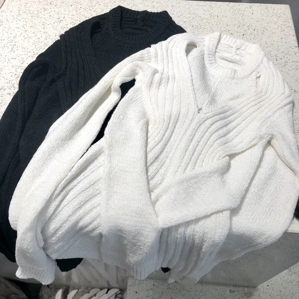 Maglione da donna irregolare autunno e inverno nuova camicia a maglia elastica allentata manica lunga girocollo Top per le donne cappotto vuoto Sexy