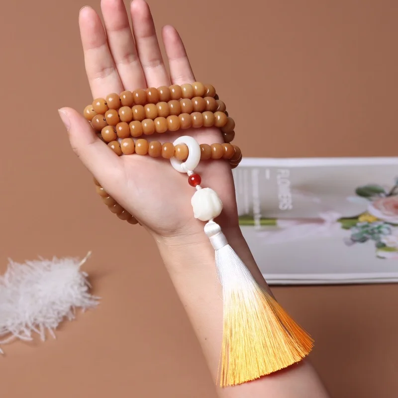 Weathered caramel-colored white jade bodhi root 108 with looped tassels, Buddhist hand-held loose beads bracelet for praye