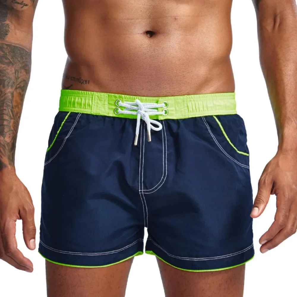 Factory direct sales men's solid color low waist three-point beach pants multi-color straight loose sports ST001