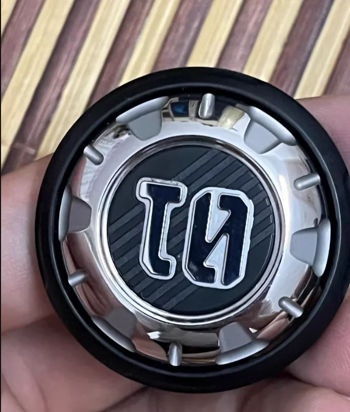 Space-time badge mechanical ratchet coin can be pressed 01edc fingertip gyro metal decompression toy.
