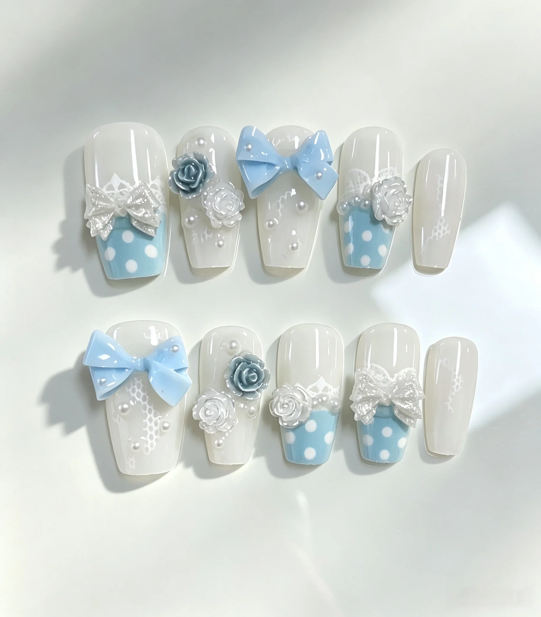 10-Piece Set of Milky White and Light Blue Polka Dot Camellia Bow Long Trapezoidal Press-On Nails, Visually Lengthen the Fingers, with Clean and Soft Lines, Photogenic and Elegant, the Preferred Nail Style for Sweet Girls.