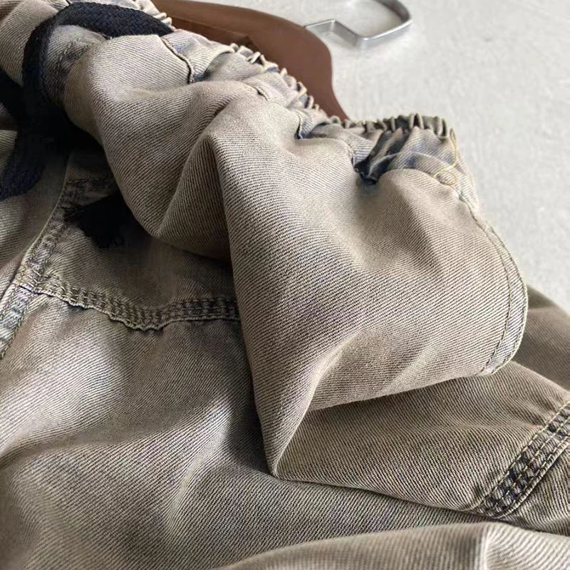 Letnie damskie spodnie jeansowe z bawełny, luźne, z elastyczną talią na sznurki, długość do kostki, łączona konstrukcja, cienkie haremki, wysoka jakość.