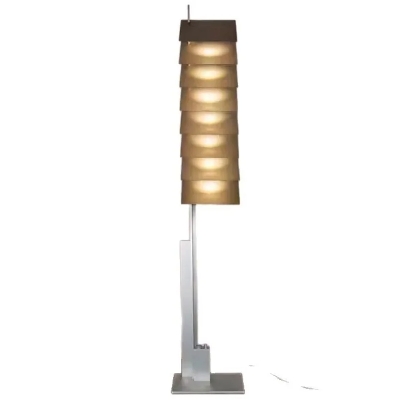Stainless steel new designer creative sense living room bedroom sofa floor lamp model room light and shadow model