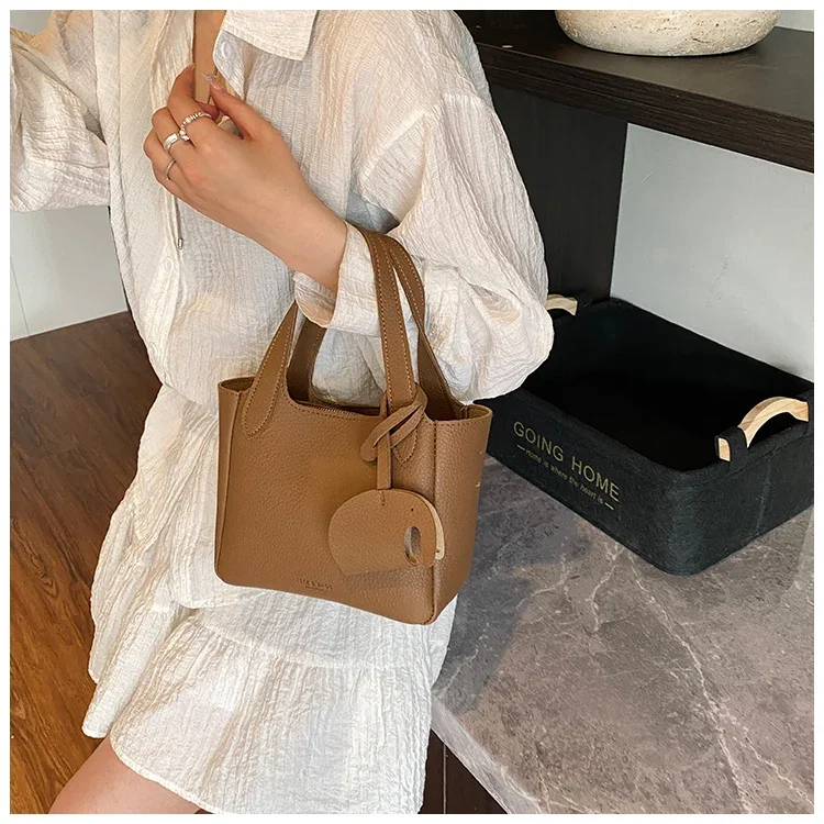 

Минималистичный элегантный кожаный клатч, повседневный месенджер для женщин, высококачественный однотонный и большой вместительности