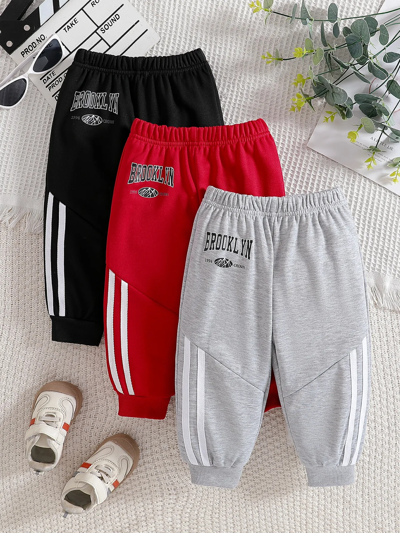 

Male baby autumn sports style letter printed casual pants with black/red/gray tricolor side stripe design for daily wear
