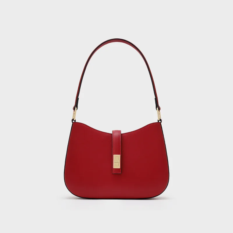 A bolsa da lua crescente. Definido por sua curva chique e couro premium. Um ombro/ponte elegante e versátil.