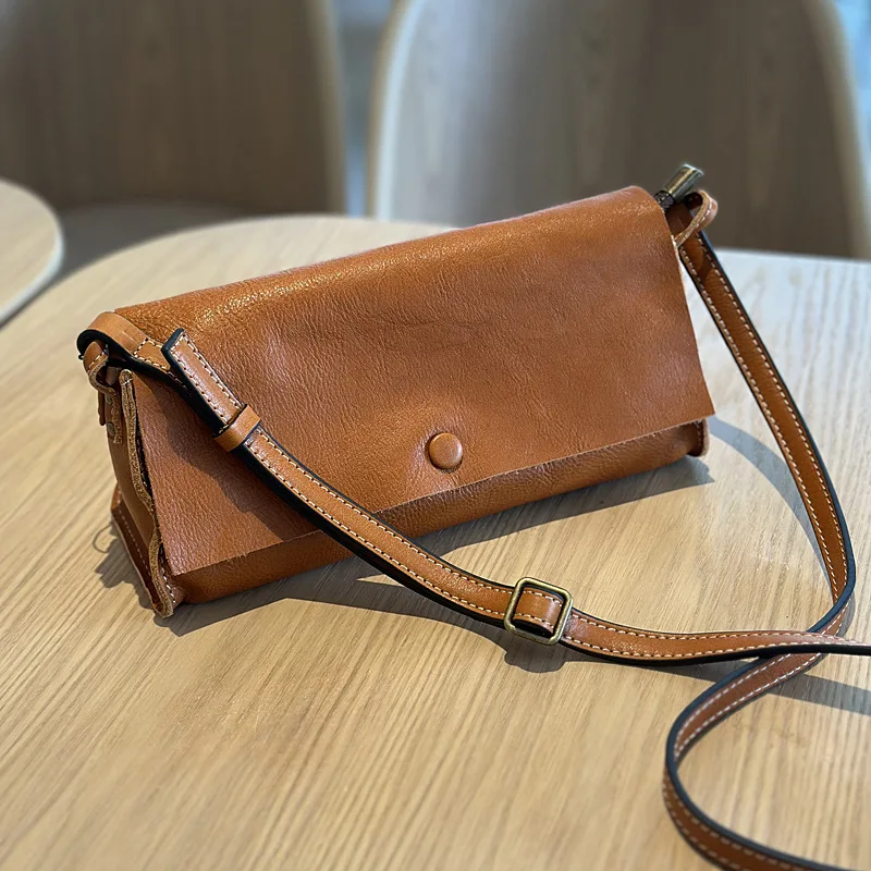 

2024 Spring and Summer Leather Messenger Women's Korean Version Literary Small Square Bag First Layer Tree Paste Leather