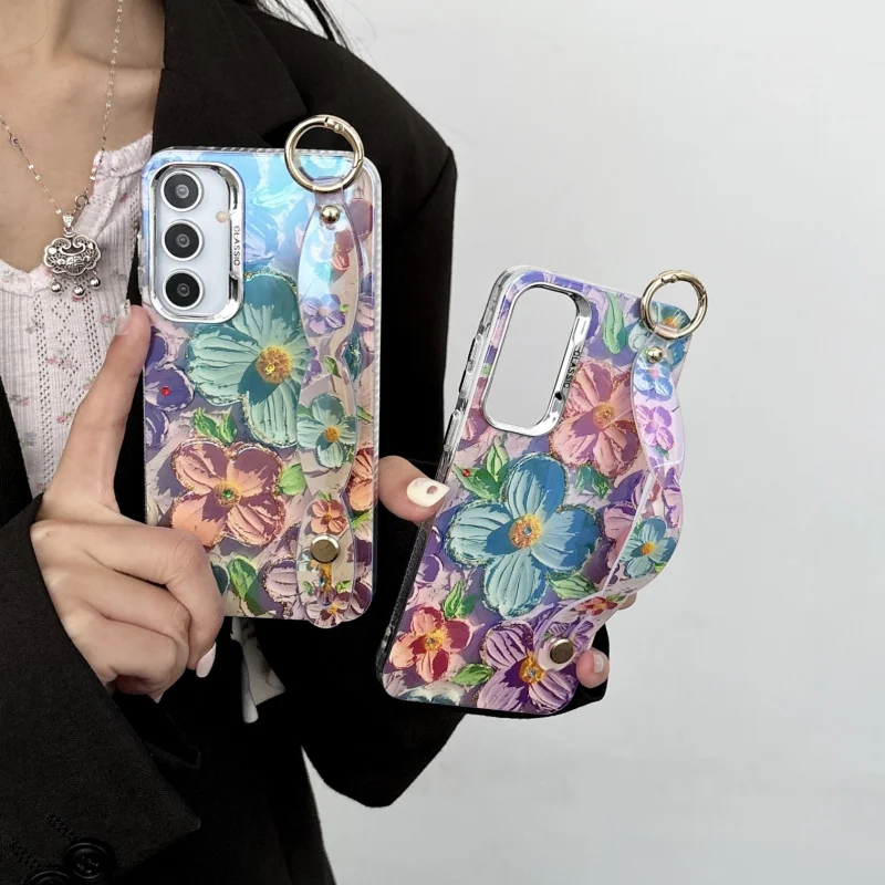 

Blue light resin rhinestones on a green background with green and blue floral patterns suitable for SamsungA55High-end phone cas