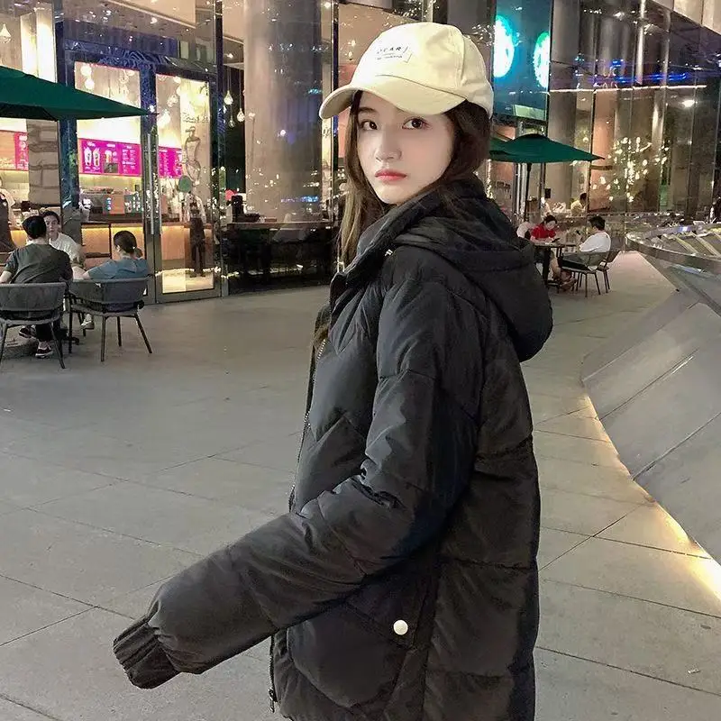 2025年 ロングダウンコットンジャケット レディース 韓国風 ルーズ パファーコート 新作 厚手 暖かい 中綿入り パーカー フード付き マント ファム ヒヴェール