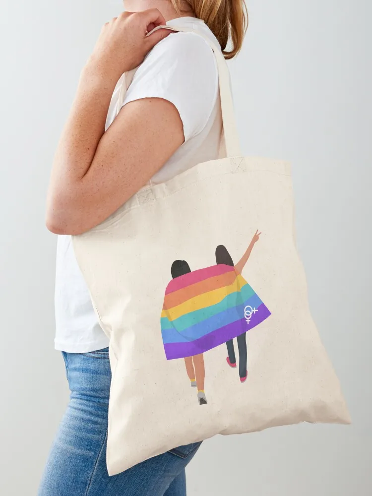 

two girls with lgbt flag pride day love wins in colours and flowers , gift for pride day , lgbt yellow magenta , blue Tote Bag