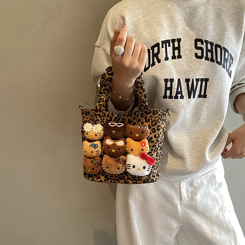 여성을위한 Hellokitty 핸드 헬드 버킷 백 가을 겨울에 다재다능한 대용량 부드럽고 독특한 크로스 바디 백 귀여운 작은 가방