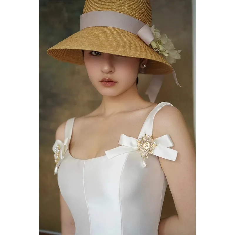 فساتين سهرة طويلة من الساتان الأبيض بفيونكة للنساء لصيف 2025 فستان فرنسي عتيق للمشاهير هيبورن كوكتيل نحيف فستان رسمي