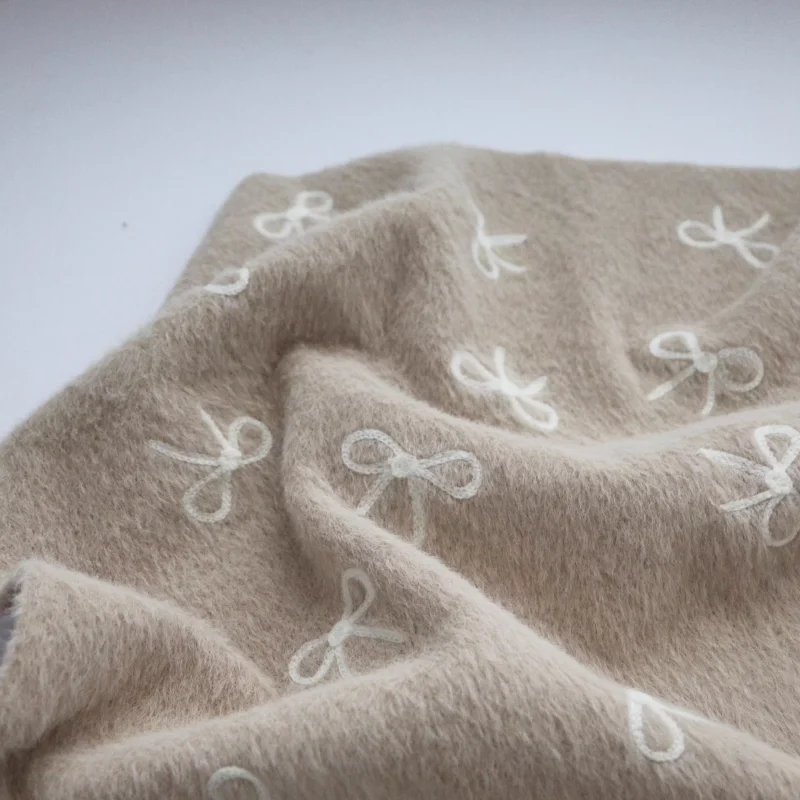 

Exquisite beige delicate bow embroidery fabric for autumn and winter handcrafted polyester fabric