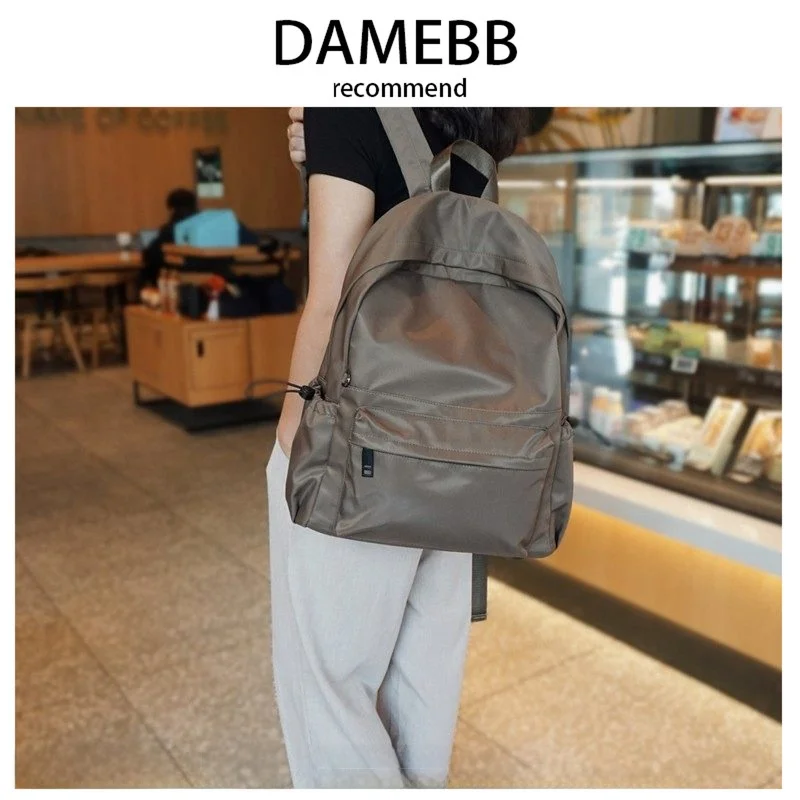 

Женский рюкзак DAMEBB из оксфордской ткани большой вместимости, водонепроницаемая дорожная сумка, простой стиль, новинка 2025 года, модная сумка через плечо