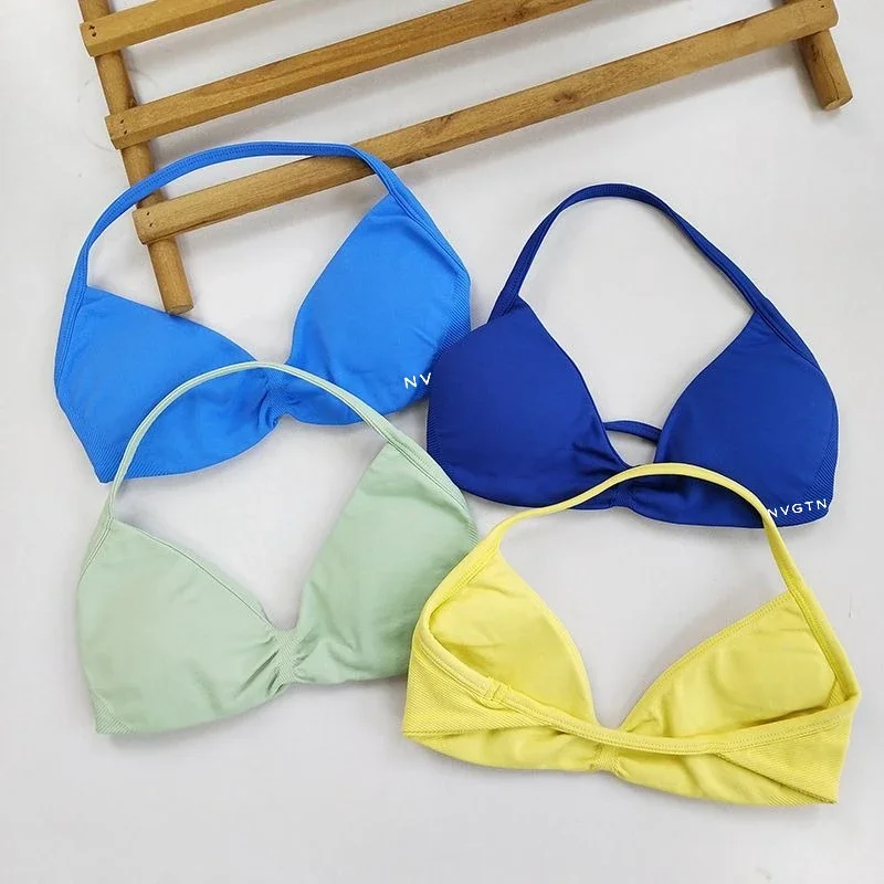 

NVGTN Dynamic Women's Sports Bra Strappy Seamless Halterneck Removable Inserts Yoga Gym Workout Fitness Top Halter Sport Bra