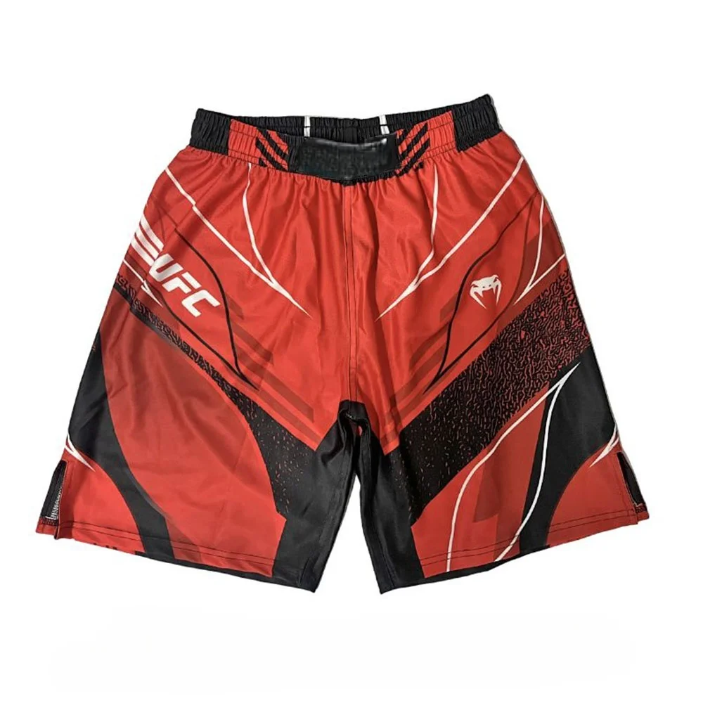 

Red Men's Fighting Shorts Produced By The UFC Ultimate Fighting Championship, Adorned With White And Black Patterns And Logos
