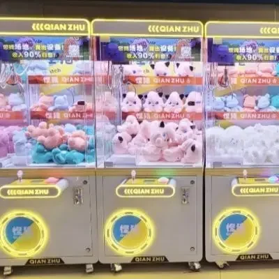 A set of machines, at least three doll machines and one coin machine