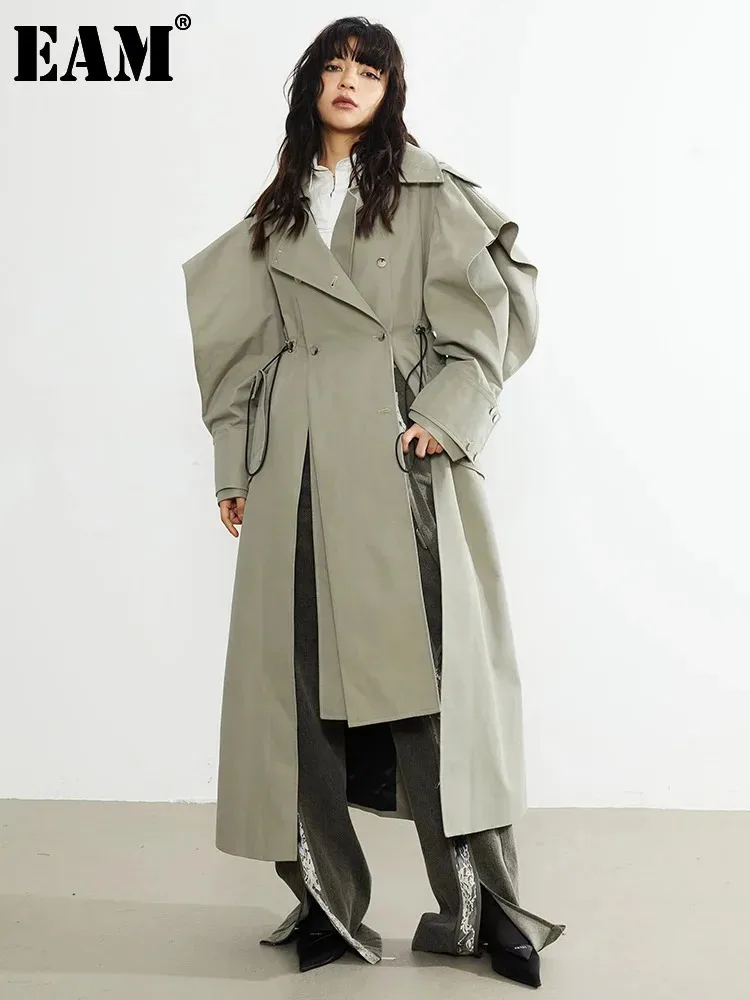 [EAM] Women Green Drawstring Irregular Big Size Long Trench New Lapel Long Sleeve Windbreaker Fashion Spring Autumn 2024 1DF3033