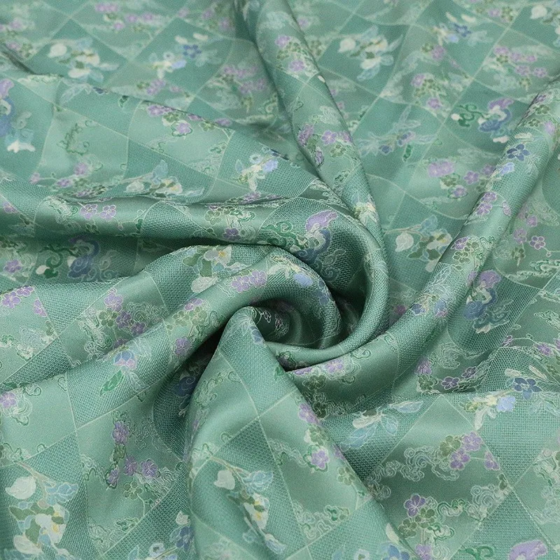 Spring new style silk jacquard perforated flower fabric printed green base plum blossom traditional Chinese cheongsam
