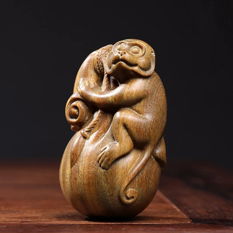 

Natural green sandalwood wood carving zodiac monkey handle piece money bag feng shui wealth creative Chinese style handicrafts