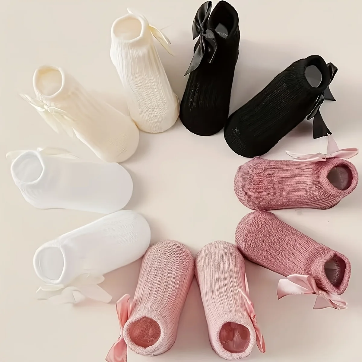 5 pairs of baby socks decorated with candy-colored bows in four seasons.
