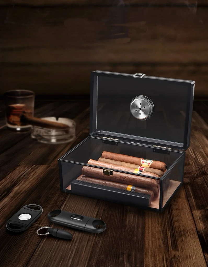 A Transparent Acrylic Cigar Box With A Sealed Snap-Lock Mechanism For Moisture Retention And A Cedar Wood Lining.