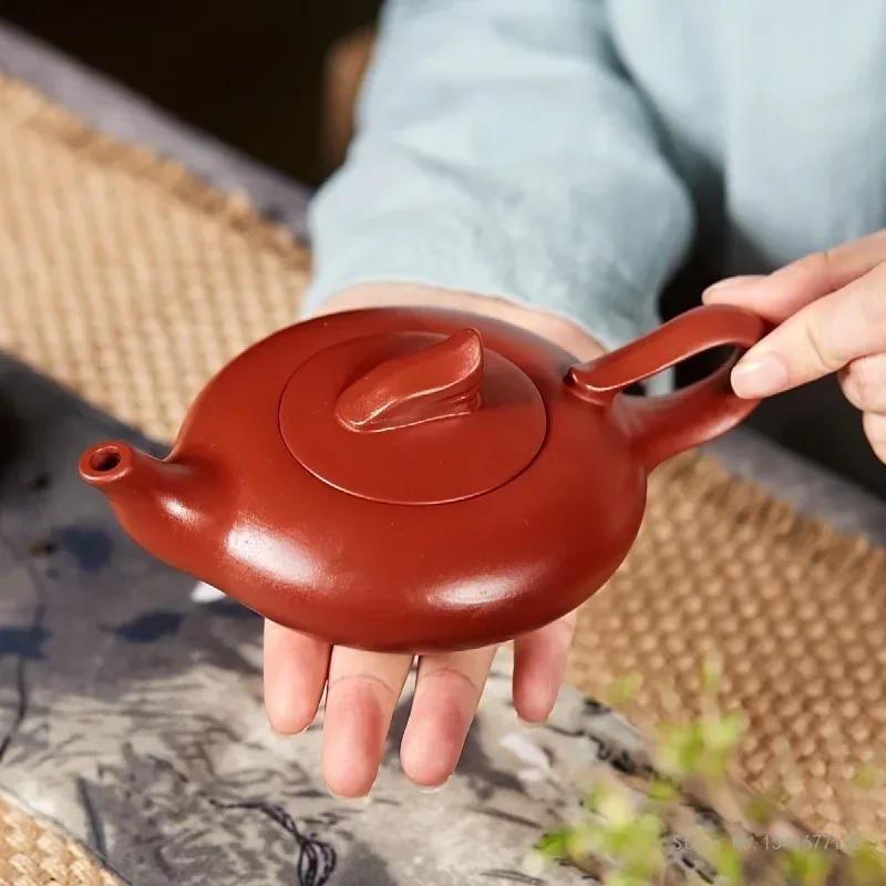 

Китайские чайные кастрюли Kongfu, ручная работа, сплошной цвет, руда лотоса, Dahongpao Xishi, Исинский фиолетовый песок, креативный, 180 мл, 1 шт.