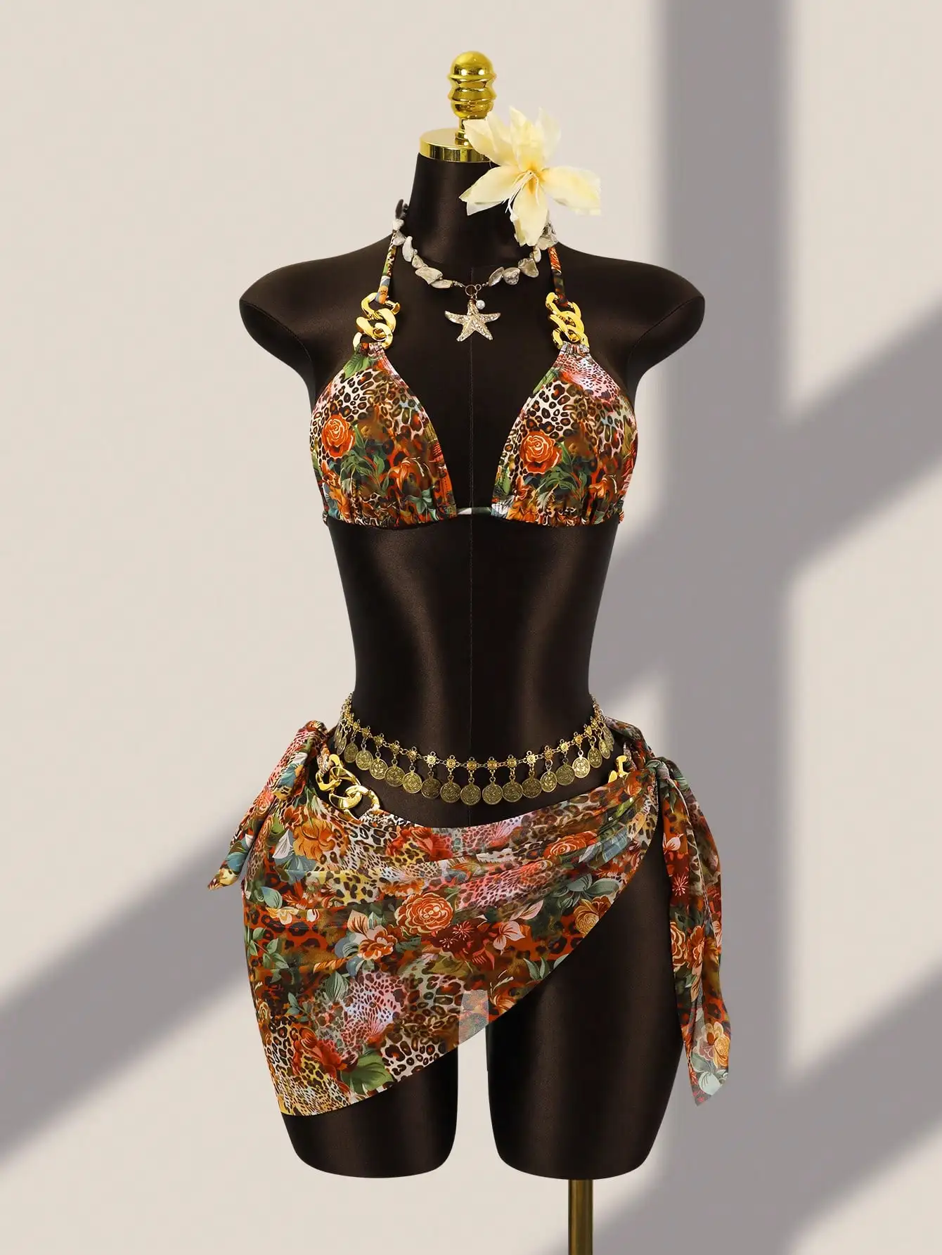 

Leopard And Floral Print Halter Bikini With Coin Chain Belt And Wrap Skirt For Beach Holiday