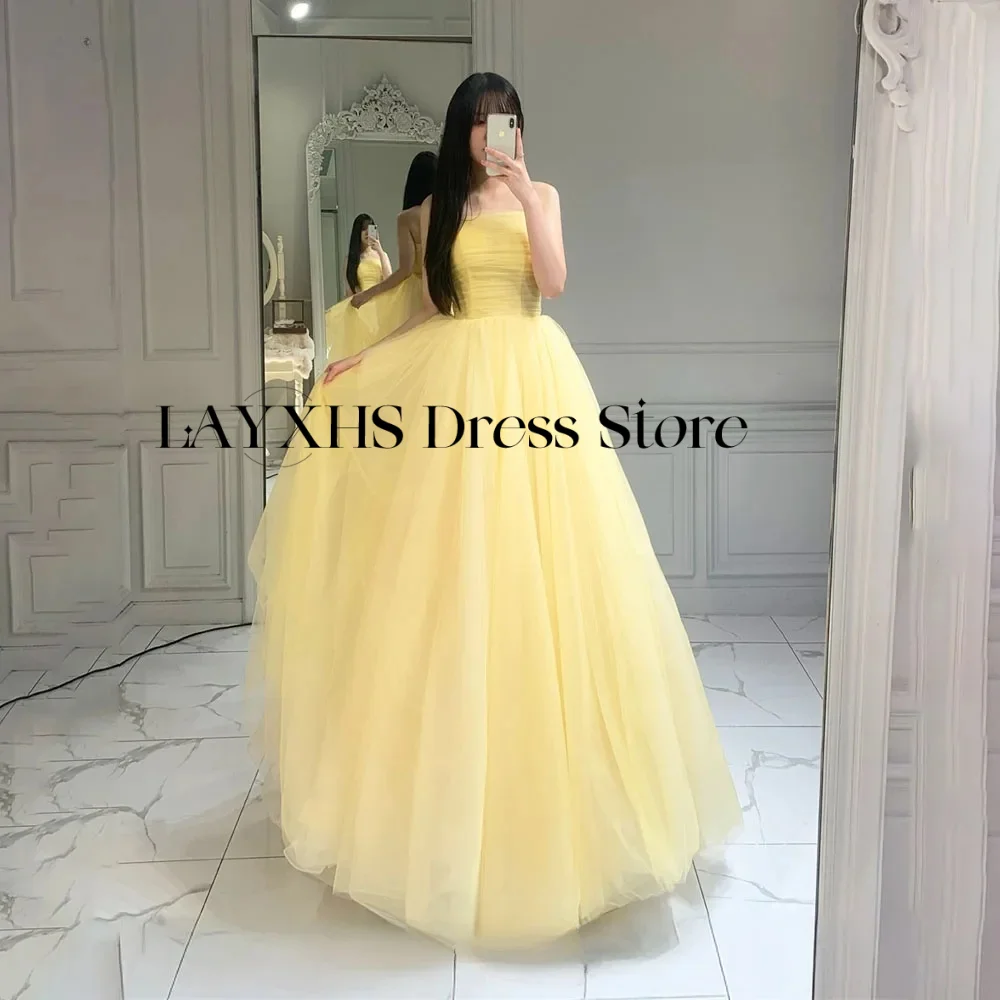 ชุดราตรีแบบไร้สายสำหรับผู้หญิง รุ่นใหม่ปี 2026 สีเหลืองอ่อน ผ้าทูลล์ สไตล์เกาหลี เหมาะสำหรับถ่ายภาพงานแต่งงาน งานปาร์ตี้ สามารถสั่งตัดได้