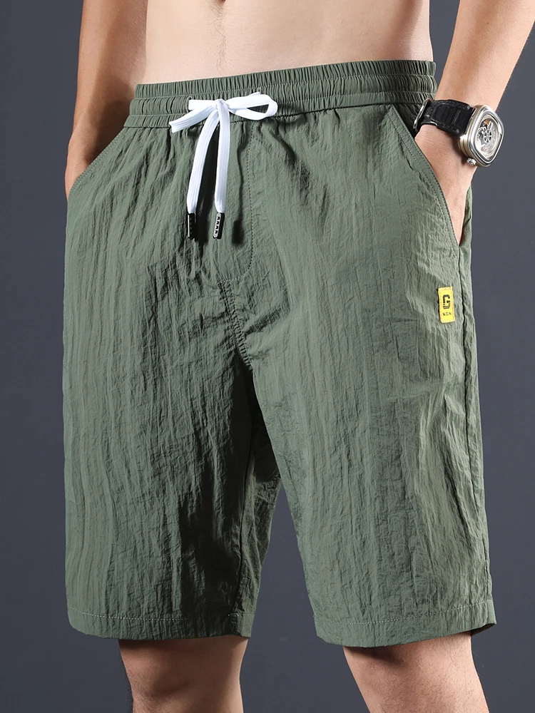 

Ice Silk Men's orts Ultra-Thin Casual Loose Sports Beach Pants Qui Dry Air Conditioning Five-Point Pants Faionable Urba...