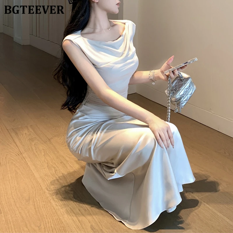 BGTEEVER فستان صيفي أنيق للسيدات نحيف مرقع من الساتان أنيق برقبة دائرية للنساء بدون أكمام فستان الورك