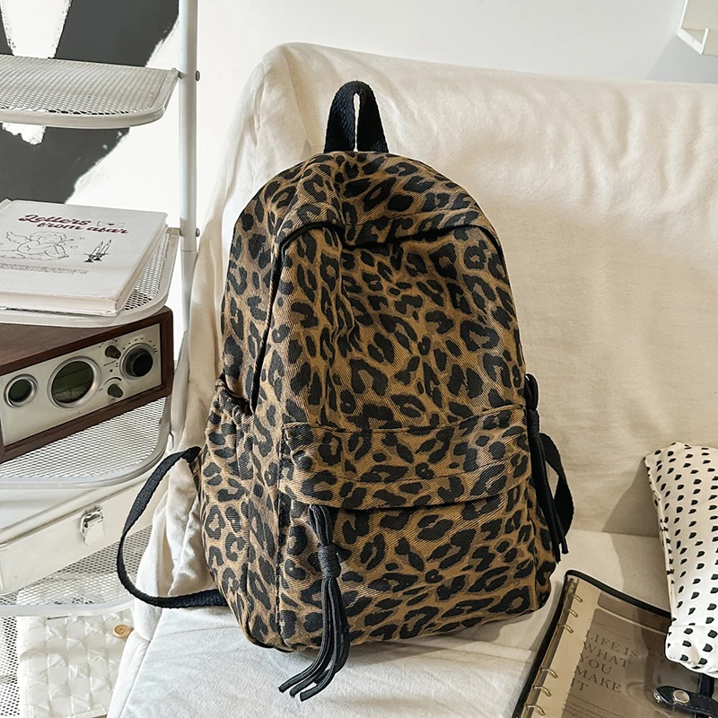 

Женский рюкзак из холщовой ткани с леопардовым принтом, декоративными шнурками, регулируемыми лямками, повседневный, для школы и путешествий, новая трендовая модель 2026 года