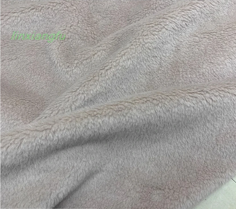 Particulate velvet full wool fur, sheep shear composite warm coat fabric.