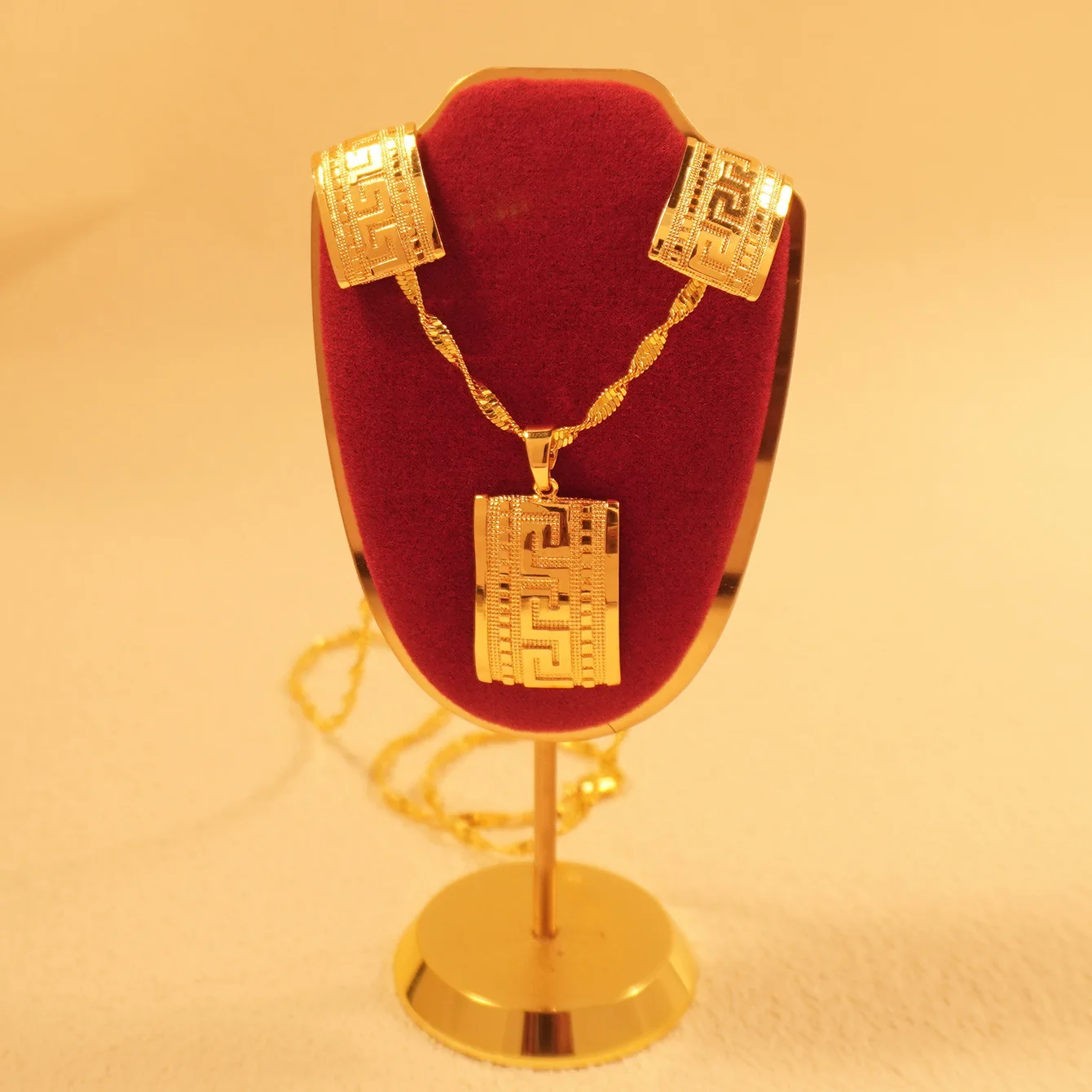 9999 gold love jewelry from a Middle Eastern Dubai lady. Square-shaped pendant earrings. A graduation season gift.
