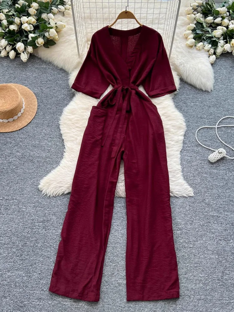 Letnie damskie kombinezony w kolorze zielonym/beżowym/burgundowo-czerwonym Elegancki damski kombinezon z krótkim rękawem i dekoltem w szpic z wysokim stanem i szerokimi nogawkami na wakacje na plaży Nowość