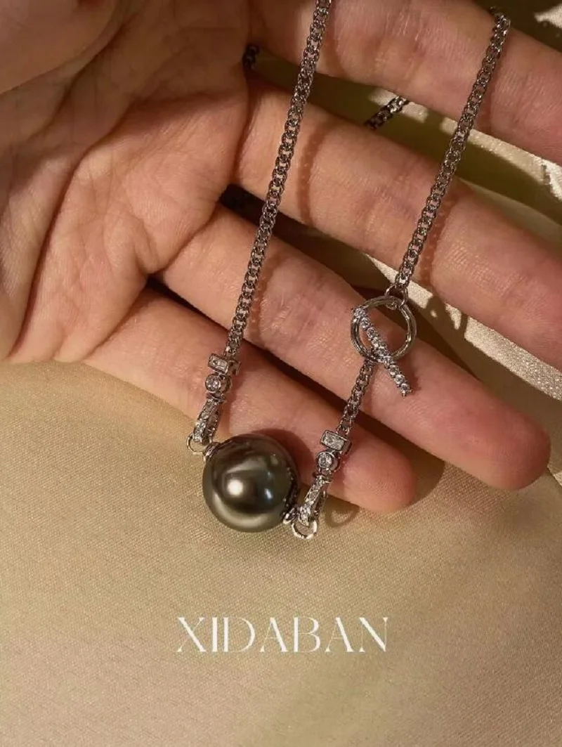 

потрясающий кулон с таитянским круглым черным зеленым жемчугом диаметром 10-11 мм, ожерелье 925s