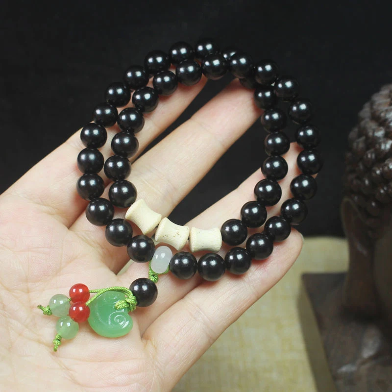 Ebony 8mm double-loop bracelet with Ruyi pendant, gold-threaded bamboo knot accessories, prayer beads, and collectible items