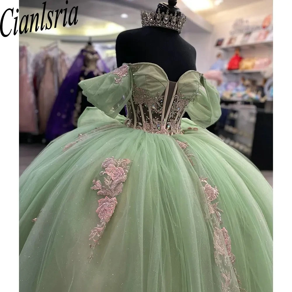 

Sage Green Illusion Beading Crystal Ball Gown Quinceanera Dresses Off The Shoulder Pink Appliques Bow Corset Vestidos De 15 Años