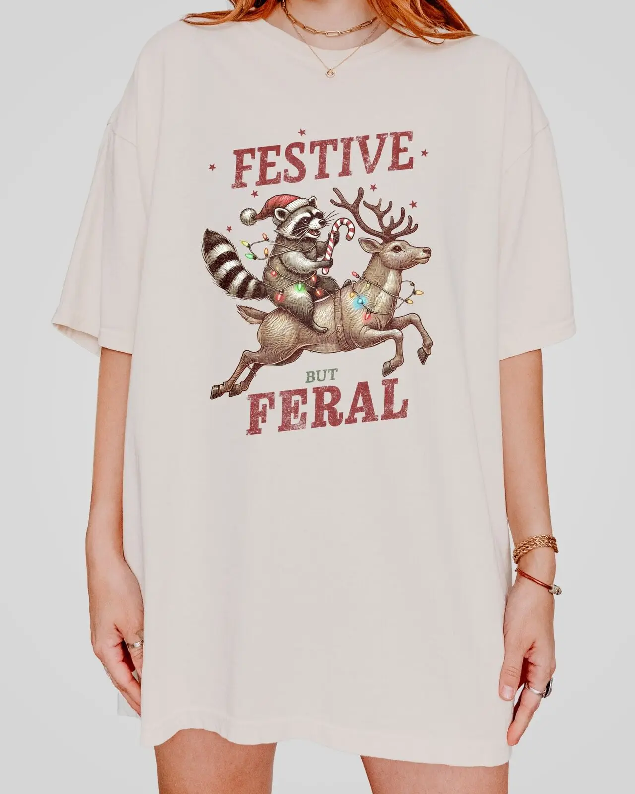 Funny Christmas T-Shirt Featuring Raccoon Riding Reindeer, Unique Holiday Gift