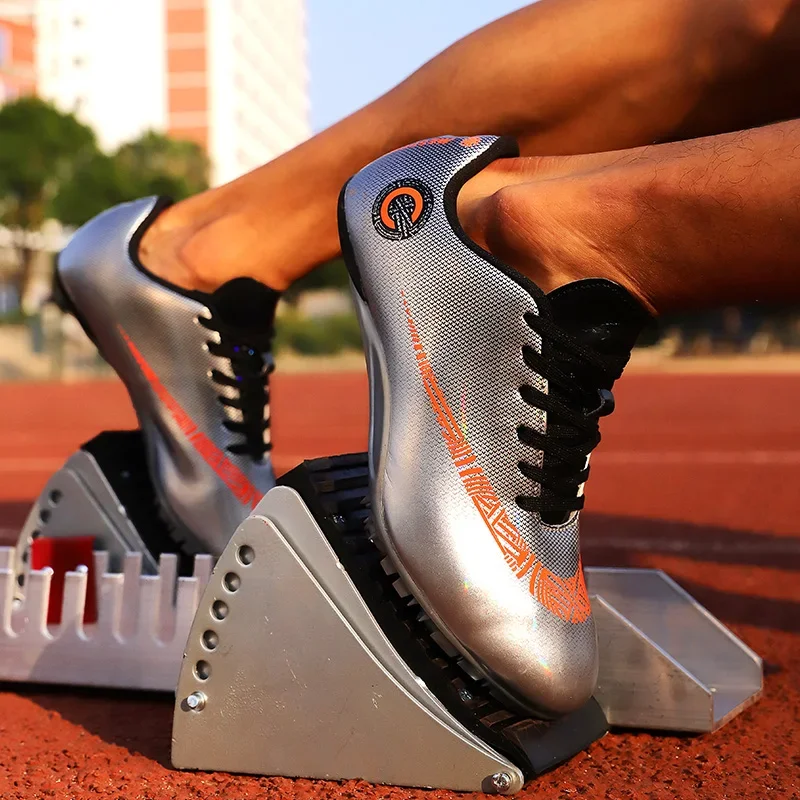 Nuovi uomini professionali tacchetti scarpe da pista e da campo scarpe da corsa ragazzo studenti salto lungo sport Match Spikes Track & FieldSneakers