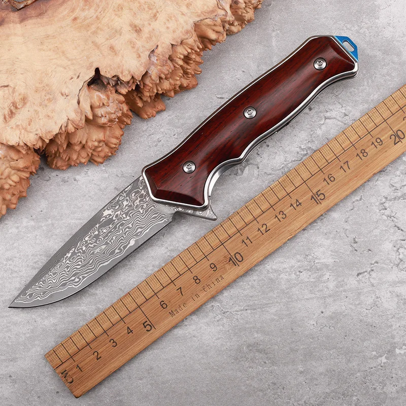 

Нож складной из дамасской стали с ручкой из сандалового дерева
