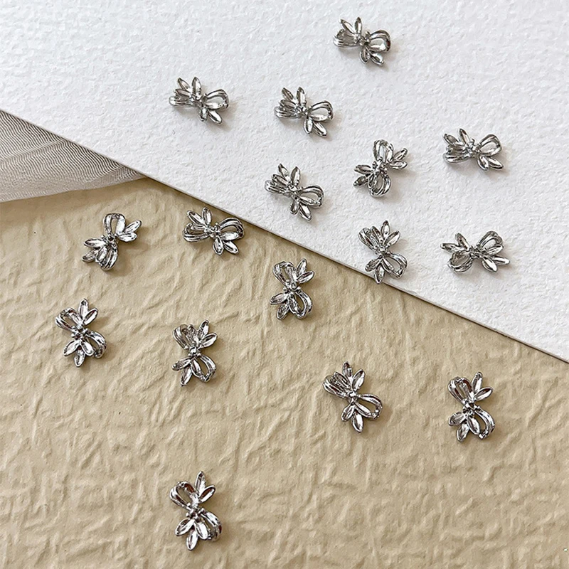 20 piezas de aleación de plata con lazo para uñas, cinta de lujo, alas de mariposa, diamantes de imitación de Metal para decoración de uñas, accesorios de manicura