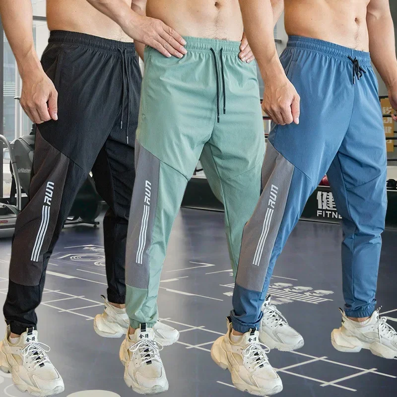 Mens Gym Fitness Running Sweatpants Workout Athletic Long Pants Outdoor Training Sports Trousers Elastic Waist Zipper Pockets