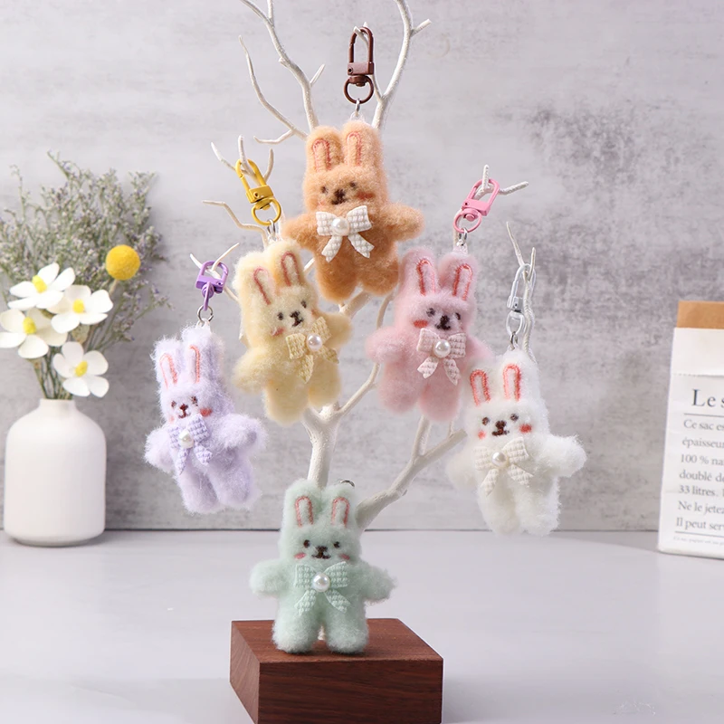 قلادة أرنب قطيفة بعقدة فراشية ، سلسلة مفاتيح أرنب كرتونية ، دمية محشوة ناعمة ، حلقة مفاتيح سيارة ، حقيبة ظهر ، ديكور