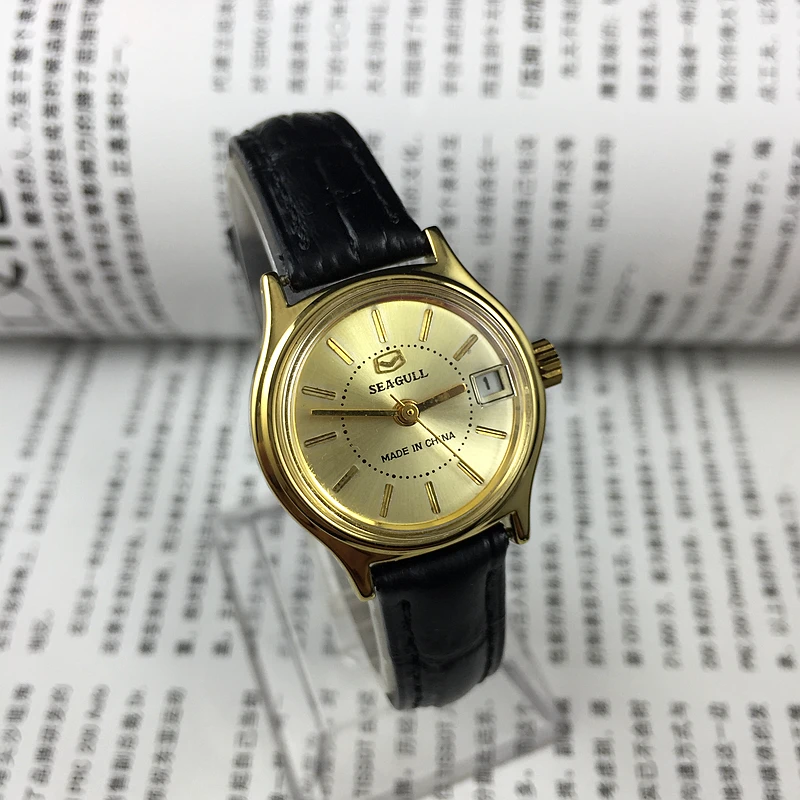 

Бренд Tianjin Seagull, желтые корпуса, желтые гвозди, одинарный календарь, ручные механические женские часы, диаметр 26 мм